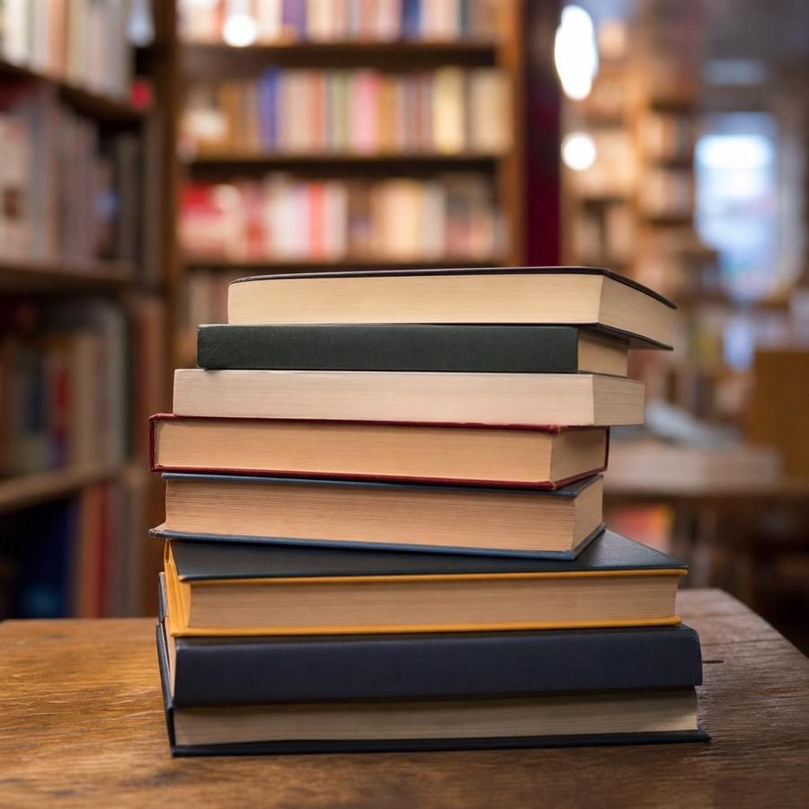 Tall stack of hardcover books